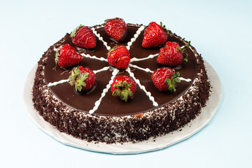 Chocolate cake with strawberries on top