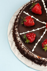 Chocolate cake with strawberries on top