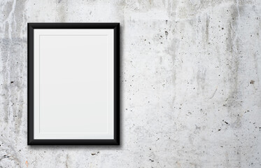 White poster or a white picture frame hanging on the brick wall background in the room.