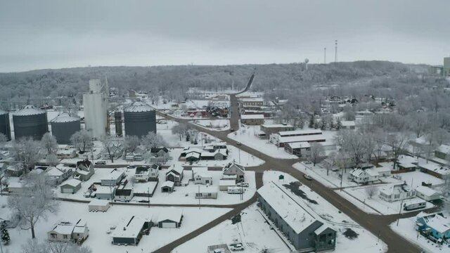 Industrial building in drone ascending view in small American town