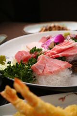 Chopsticks holding sashimi on a simple background  심플한 배경에 회를 집고있는 젓가락