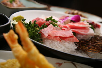 Chopsticks holding sashimi on a simple background  심플한 배경에 회를 집고있는 젓가락