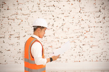 Internal Audit Engineering construction engineer hand holding blueprint inside building structure