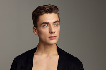 handsome man black jacket fashion hairstyle close-up attractive look model