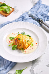 Zander Fish Baked in Dough with Caviar and Cream Sauce. Restaurant food plate on white table. Delicious baked fish meal.