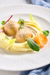 Mashed potatoes and rabbit cutlets. Restaurant food plate on white table. Delicious, healthy, organic dinner concept.