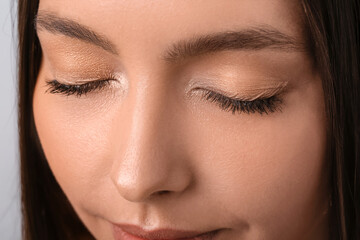 Beautiful young woman with eyelash extensions, closeup