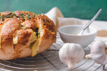 Fresh garlic bread on table, closeup