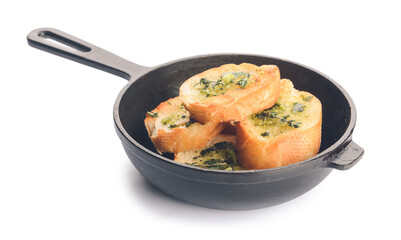Frying pan and toasted bread with garlic on white background