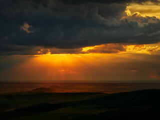 beautiful sunset with cloudy sky over the field in Dobrogea, Romania