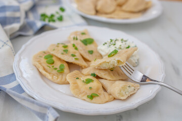 pierogi ruskie, Baked dumplings stuffed with curd cheese and potatoes 