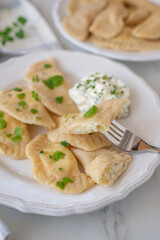 pierogi ruskie, Baked dumplings stuffed with curd cheese and potatoes 