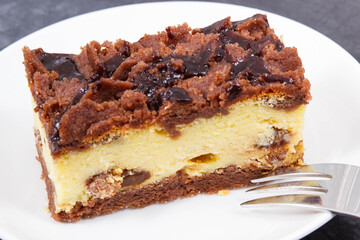 Piece of fresh cheesecake on white plate. Delicious dessert