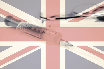 Flagge von Gro&szlig;britannien, Spritze und Impfung gegen Corona Virus