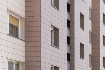 Fragment residential apartment with flat building exterior. Detail of New luxury house and home complex.