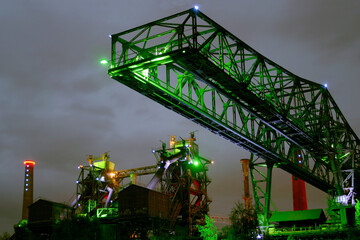 Night shot of Landschaftspark Nord, old illuminated industrial ruins in Duisburg, Germany