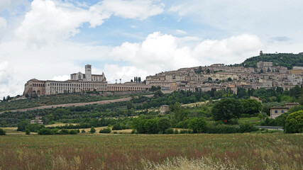 Fototapeta na wymiar Assisi historic old town with Basilica of St. Francis on the hill cityscape, place of worship and birthplace of St. Francis, Assisi, Umbria, Italy