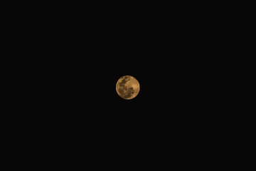 Full moon isolated on black space background.