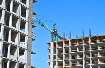 Crane and highrise construction site