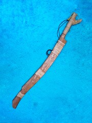 'Parang ilang' is a traditional machete of the Malaysian Borneo 'Dayak' people. Made from durable wood with nice carving patterns and also have spiritual energy of worrior.