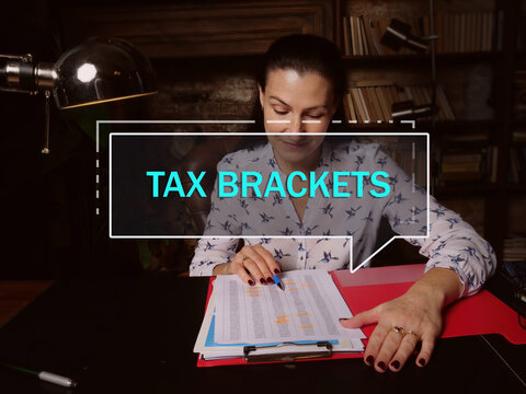  TAX BRACKETS Text In Footnote Block. Budget Analyst Checking Financial Report Tax Brackets show You The tax rate You Will Pay On Each Portion Of Your Income.