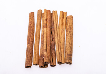 Cinnamon sticks, classic spice from the inner bark of tropical Asian trees, flavorful and aromatic for cooking, baking, health food and medicinal uses.