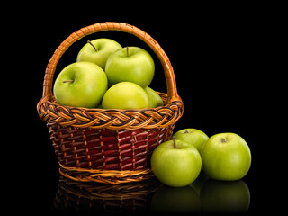 Green apples in wattle basket
