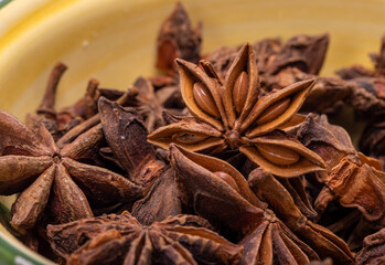 Star anise in a vintage ceramic bowl