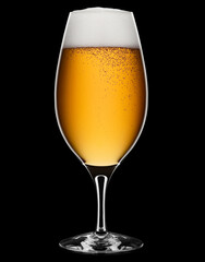 Fresh foamy beer in a glass on a black + clipping path.