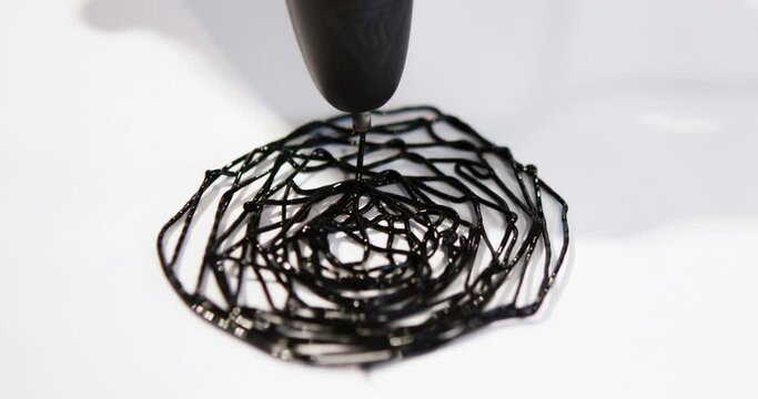Man 3d pen drawing circles close-up on white paper