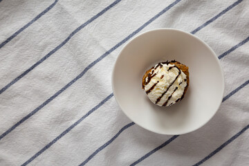 Homemade Chocolate Banana Bread Pudding with Ice Cream, top view. Flat lay, overhead, from above. Copy space.