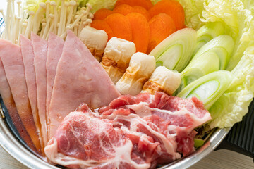 sukiyaki or shabu hot pot black soup with meat raw and vegetable