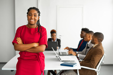 team of young african people in the office at the table with a laptop 