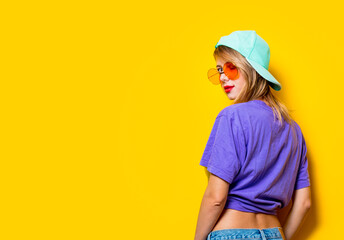 Young style girl with orange glasses and cap