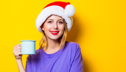 girl in Christmas hat and cup