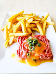 Tasty Steak tartare (Raw beef) - classic steak tartare on white plate