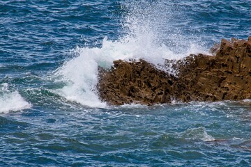 waves crashing on rocks