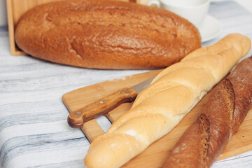 fresh loaves on a breadbasket on the table breakfast 