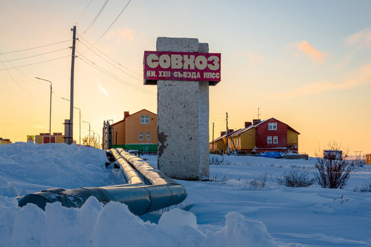Tavayvaam, Chukotka, Russia - January 22, 2020. A sign near the road at the entrance to the Tavayvaam village. Text in Russian "State farm named after the XXII Congress of the CPSU". Rural locality.
