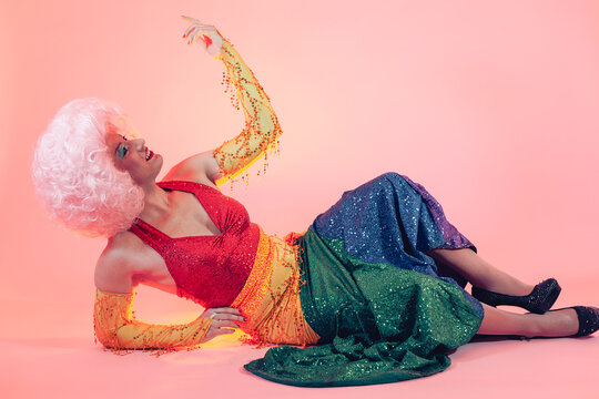 studio portrait of a drag queen on pink background