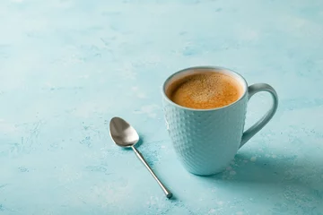 Acrylic prints Cafe Cup of coffee on blue background