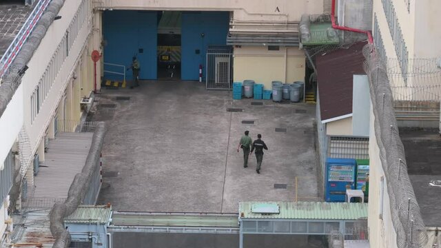A police vehicle arrives at the male correctional Lai Chi Kok Reception Centre as penitentiary guards secure the area in Hong Kong.