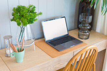 A laptop computer in working corner in the house