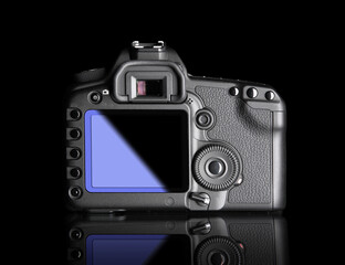 Digital Camera, back view. It is isolated on black background with reflection