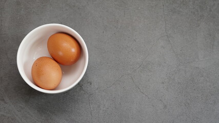 fresh eggs in a white bowl