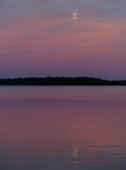 moon reflection with sunset changing colours to pink