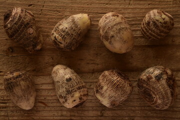 Fresh taro on wooden board.