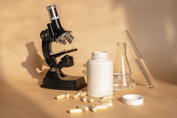 Laboratory for the creation and study of tablets. Omega 3 capsules. Chemical equipment, flasks and measuring cups. Top Hero. 
Pills from quality raw materials