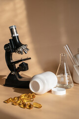 Laboratory for the creation and study of tablets. Omega 3 capsules. Chemical equipment, flasks and measuring cups. Top Hero. 
Pills from quality raw materials