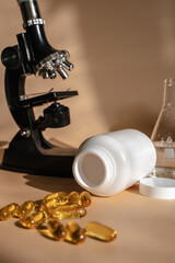 Laboratory for the creation and study of tablets. Omega 3 capsules. Chemical equipment, flasks and measuring cups. Top Hero. 
Pills from quality raw materials